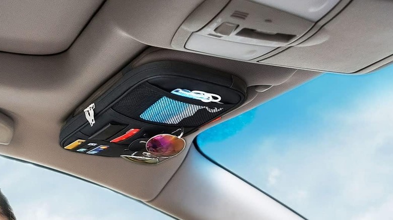A sun visor organizer in a car