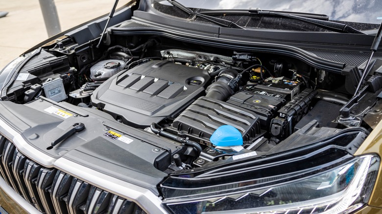 hood of car open to show engine