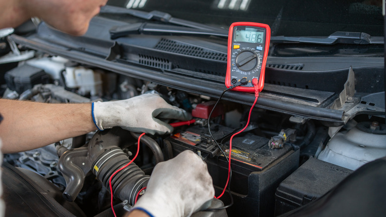 mechanic testing a car's electronics systems