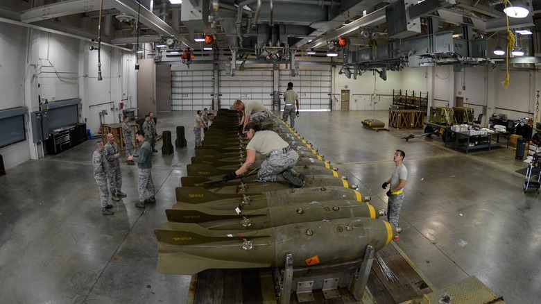 U.S. Air Force members work with munitions.
