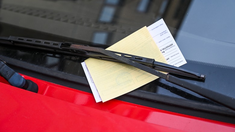 A parking ticket on a windshield