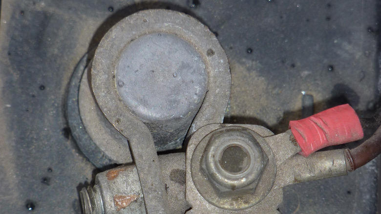 A close up of a connected battery terminal