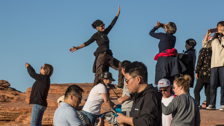 Thousands of weekend visitors flock to view the unusual Horseshoe Bend of the Colorado River in Grand Canyon NP.