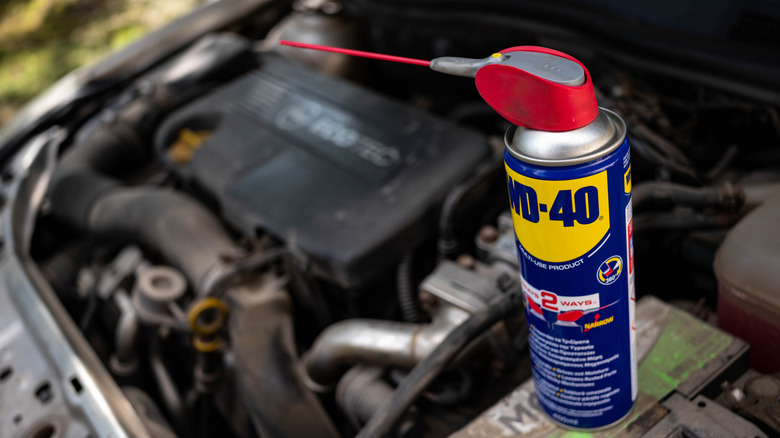 Can of WD-40 in a Vauxhall engine bay