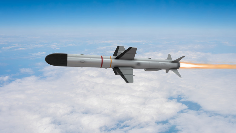 A 3D rendering of an anti-ship missile flying above the clouds