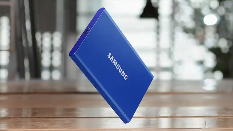 A blue Samsung external SSD on a table