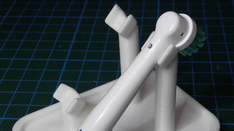 A replaceable brush head on the printed brush holder