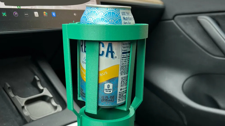 Gimbal cup holder with a can inside a car