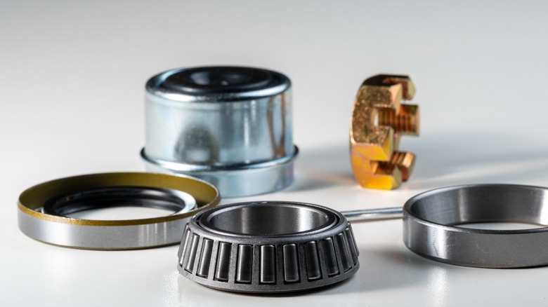 The replaceable parts of a wheel bearing, including the roller bearing, race, seal, nut, and dust cap.