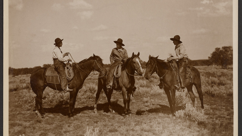An old picture of three cowboys on their horses