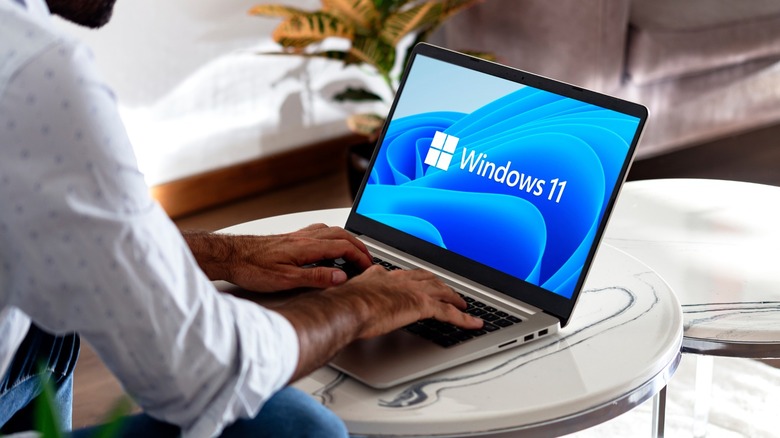 Person using a Windows 11 laptop