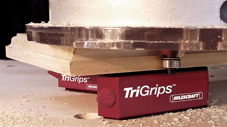 A set of Milescraft TriGrips holding up a woodworking project.