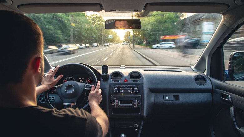 Person driving car interior view