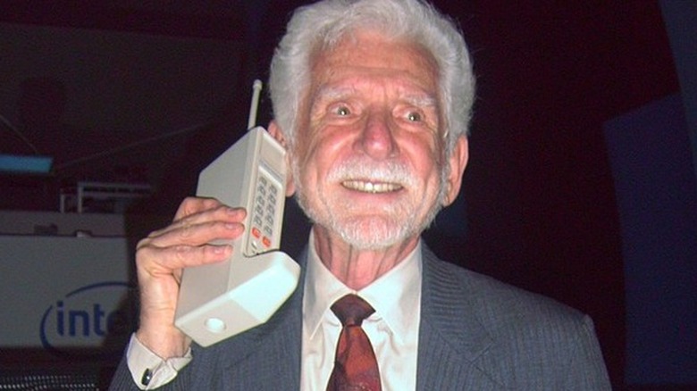 Martin Cooper with prototype DynaTAC cellphone