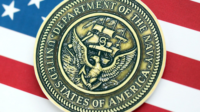 The U.S. Navy seal on an American flag.