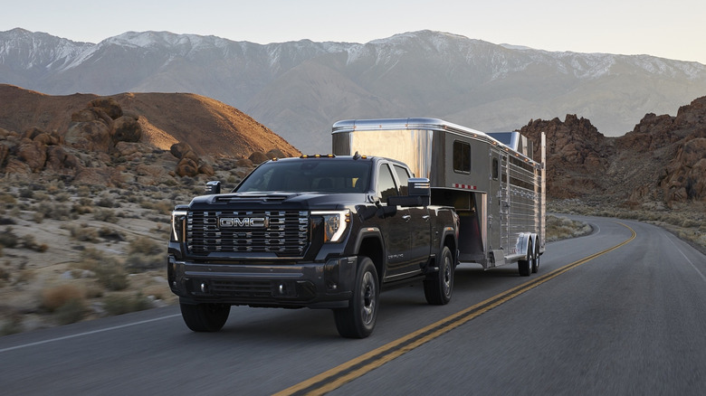 2027 GMC Sierra HD towing a horse trailer