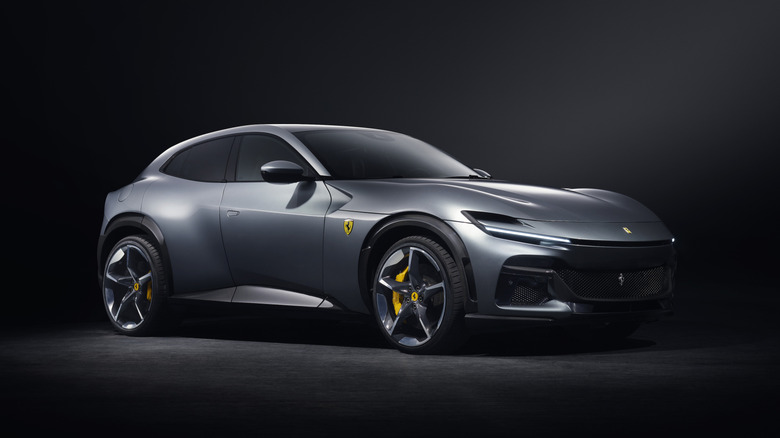Ferrari Purosangue parked in a dimly lit studio