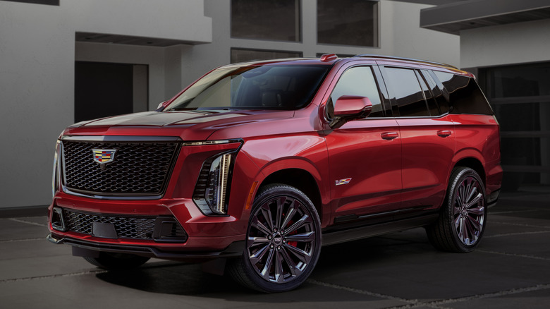 Cadillac Escalade-V parked in front of a home