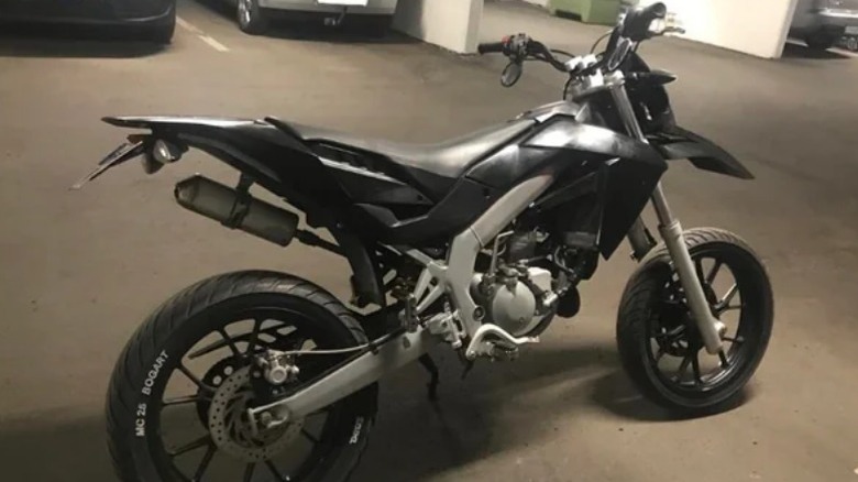 Aprilia SX50 parked in garage