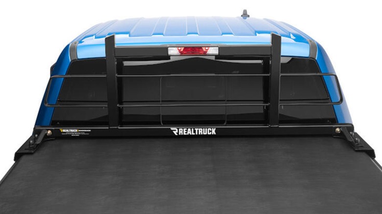 The Original Headache Rack by Realtruck installed on a blue pickup truck