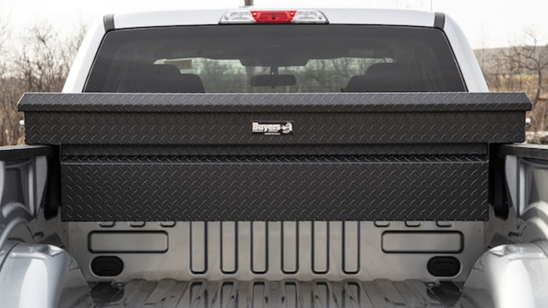A Buyers crossbed toolbox on a white pickup truck