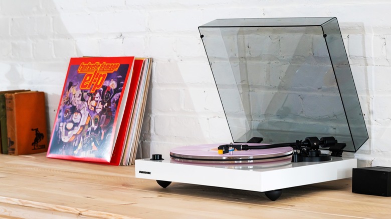 White Fluance RT85N playing a record with the lid up.