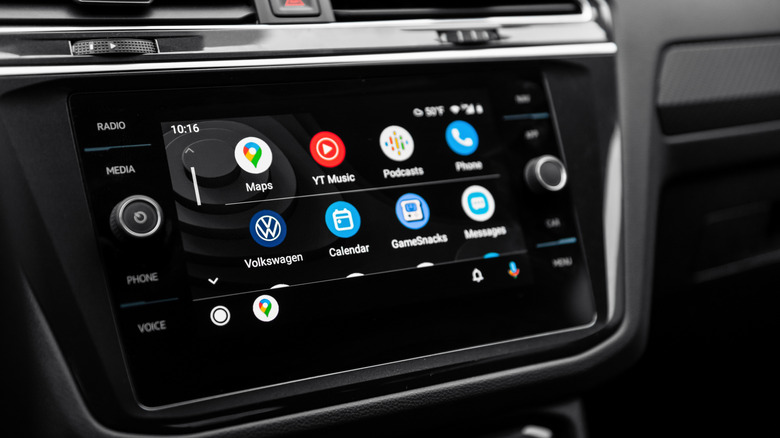 Close-up shot of infotainment system in Volkswagen car interior displaying Android Auto main screen menu in a car