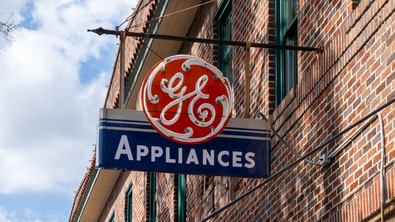 GE Appliances storefront sign hanging off a brick building