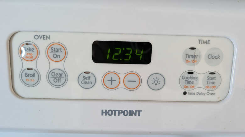 close-up of control panel on a white Hotpoint oven