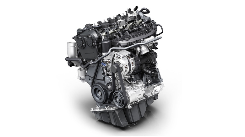An EA888 engine from the third generation (EA888-III) photographed on a studio backdrop.