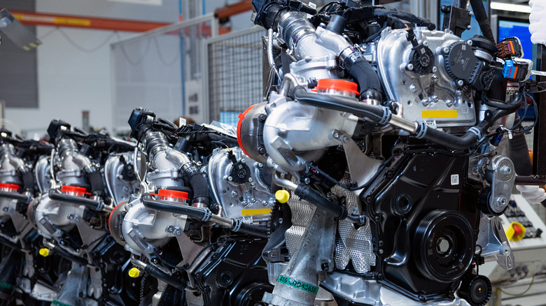 A view of four Audi EA888 four-cylinder engines in the factory where Audi produces the motor.