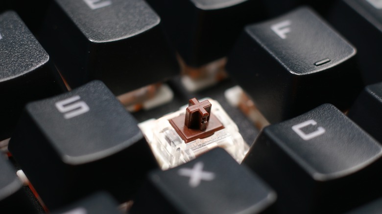 close-up of mechanical keyboard with missing D key