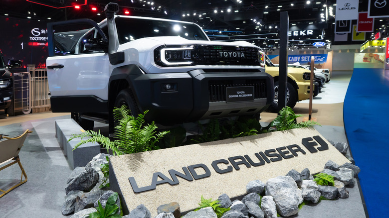 Front view of silver Toyota Land Cruiser FJ on display at car show.