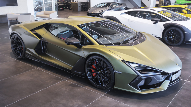 A green Lamborghini Revuelto in a showroom
