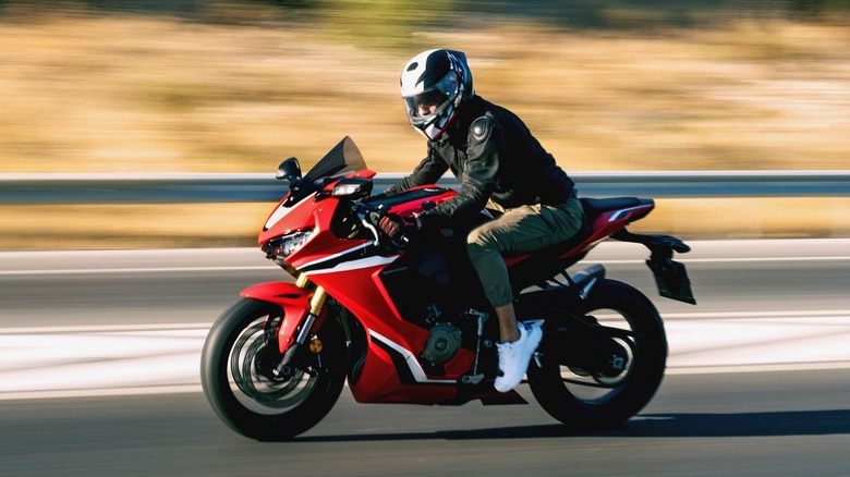 person riding supersport bike