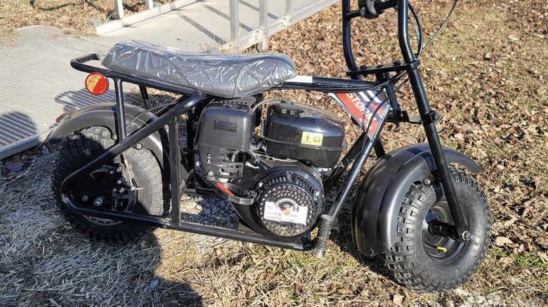 Go Power Sports Trailmaster storm 200 parked in grass
