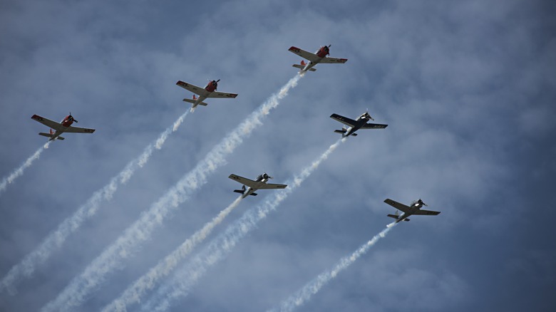 six war planes flying