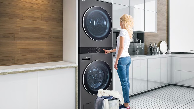 Person using LG washer and dryer