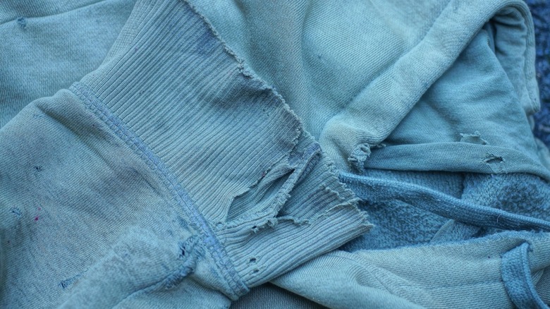 Torn blue clothes