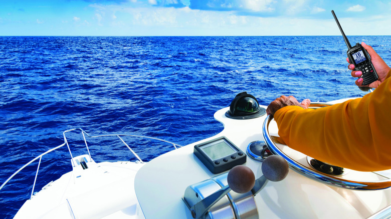 Standard Horizon radio used as someone drives a boat