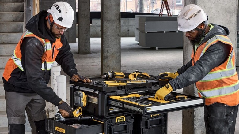 Crewmen using DeWalt tools