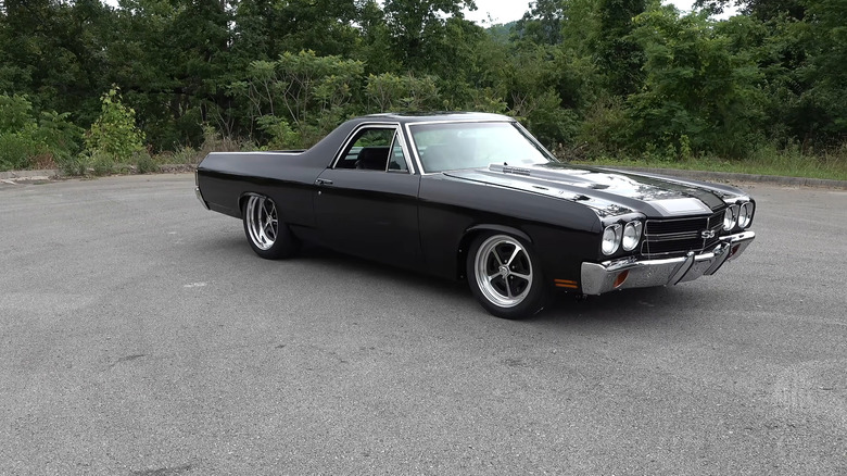 A black Chevrolet El Camino SS pickup muscle truck.