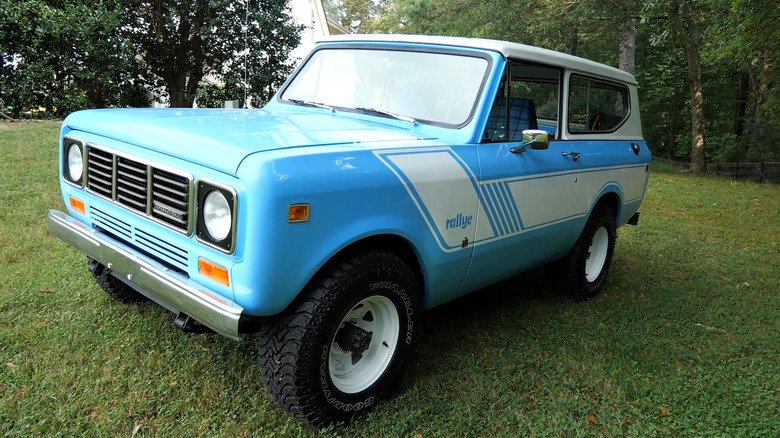 A light-blue International Harvester Scout II from the 1970s on grass.