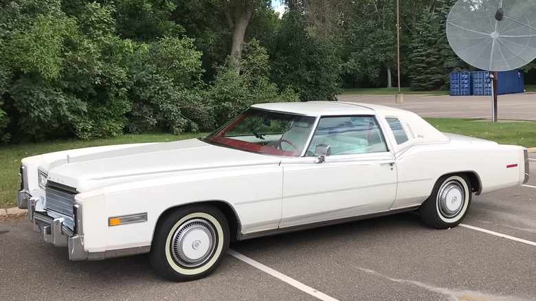 A 1977 Cadillac Eldorado Biarritz in white, parked.