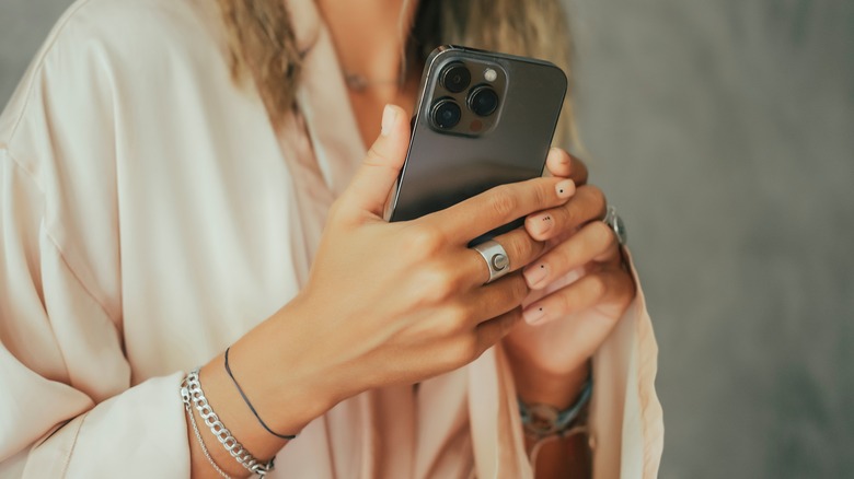 woman holding iPhone
