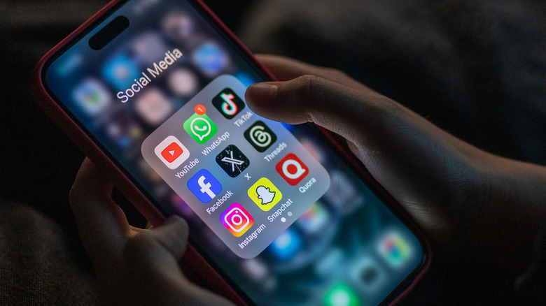 kid using iPhone with social media apps