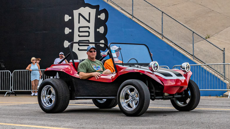 Man driving Meyers Manx