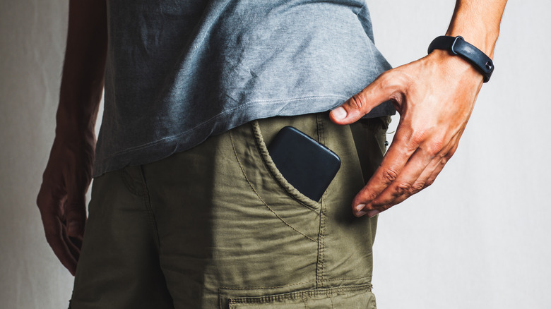 Person with a phone in their pocket.
