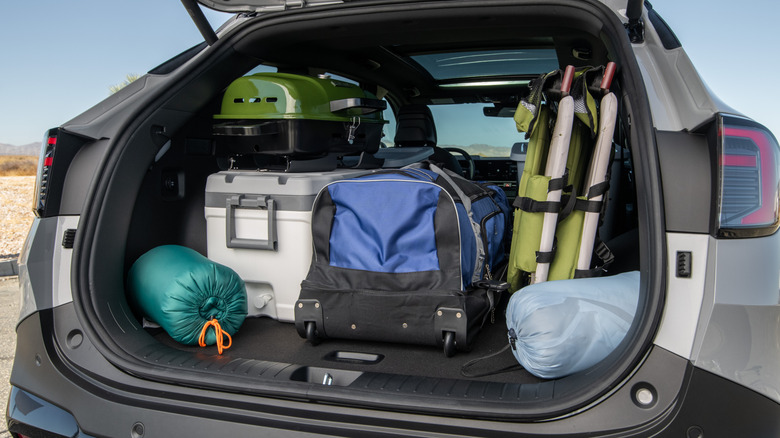 Kia Sportage trunk filled with gear