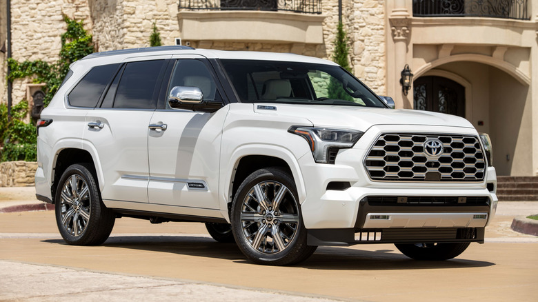 Toyota Sequoia parked near a mansion